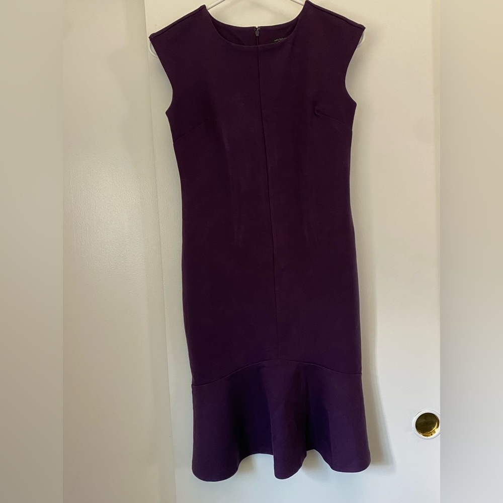 Ann Taylor dress plum colored size 00P. Never been worn with tags still on it.